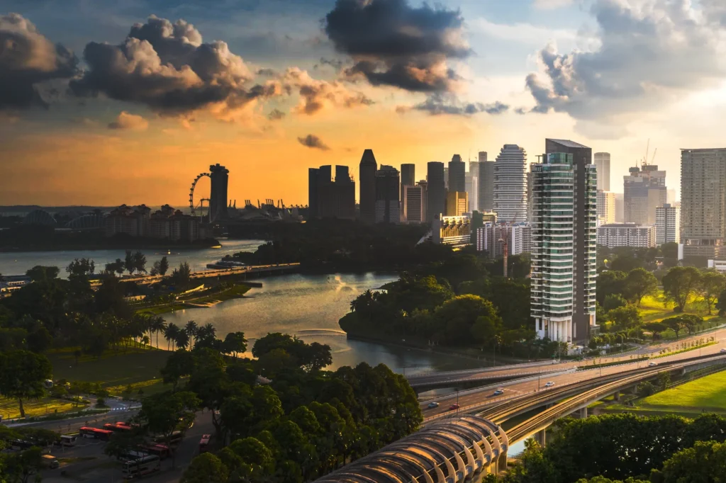 A view of a city and a river at sunset