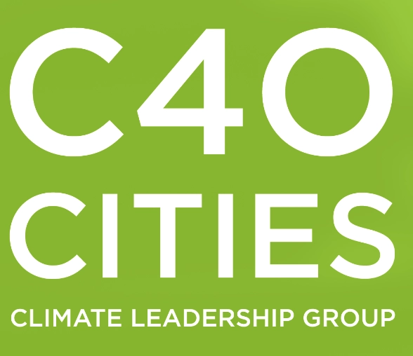 A green and white sign that says 40 cities